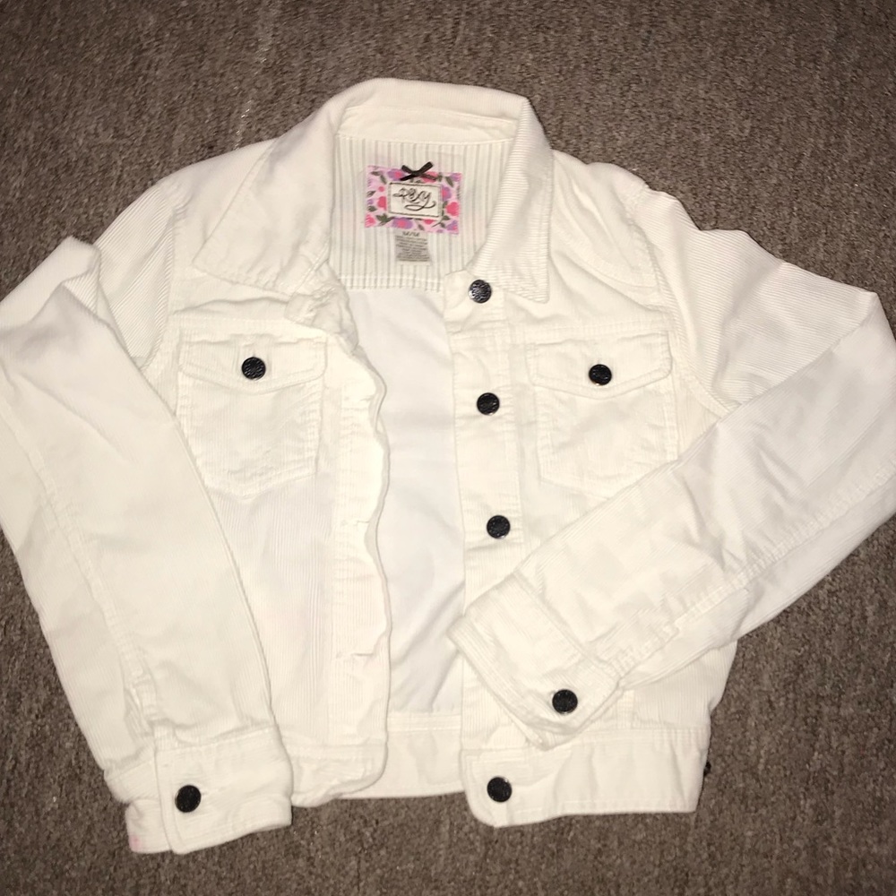 White jacket with flowers in the back